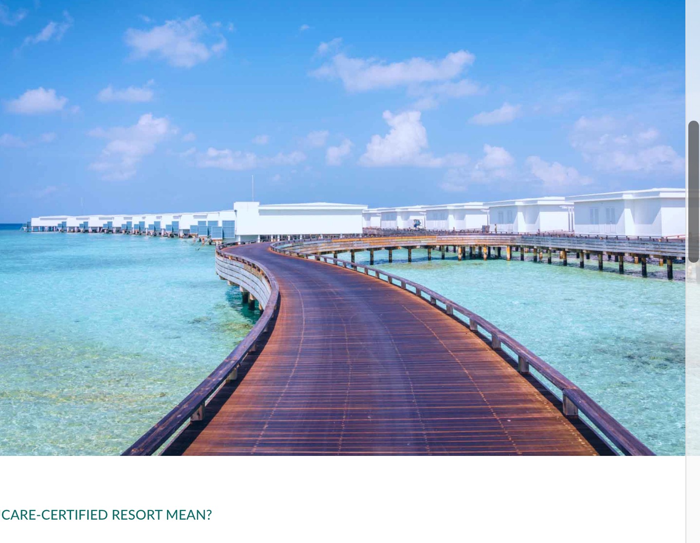 An accessible walkway to water villas.  Th ewater villas are over the sea in the background