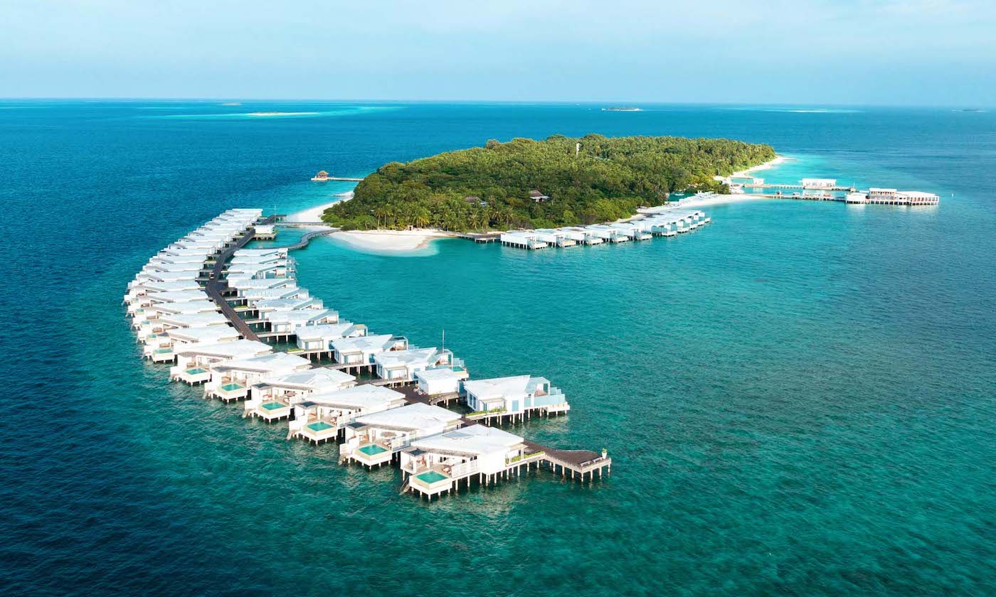 A semi aerial view of the water villas coming out from the island